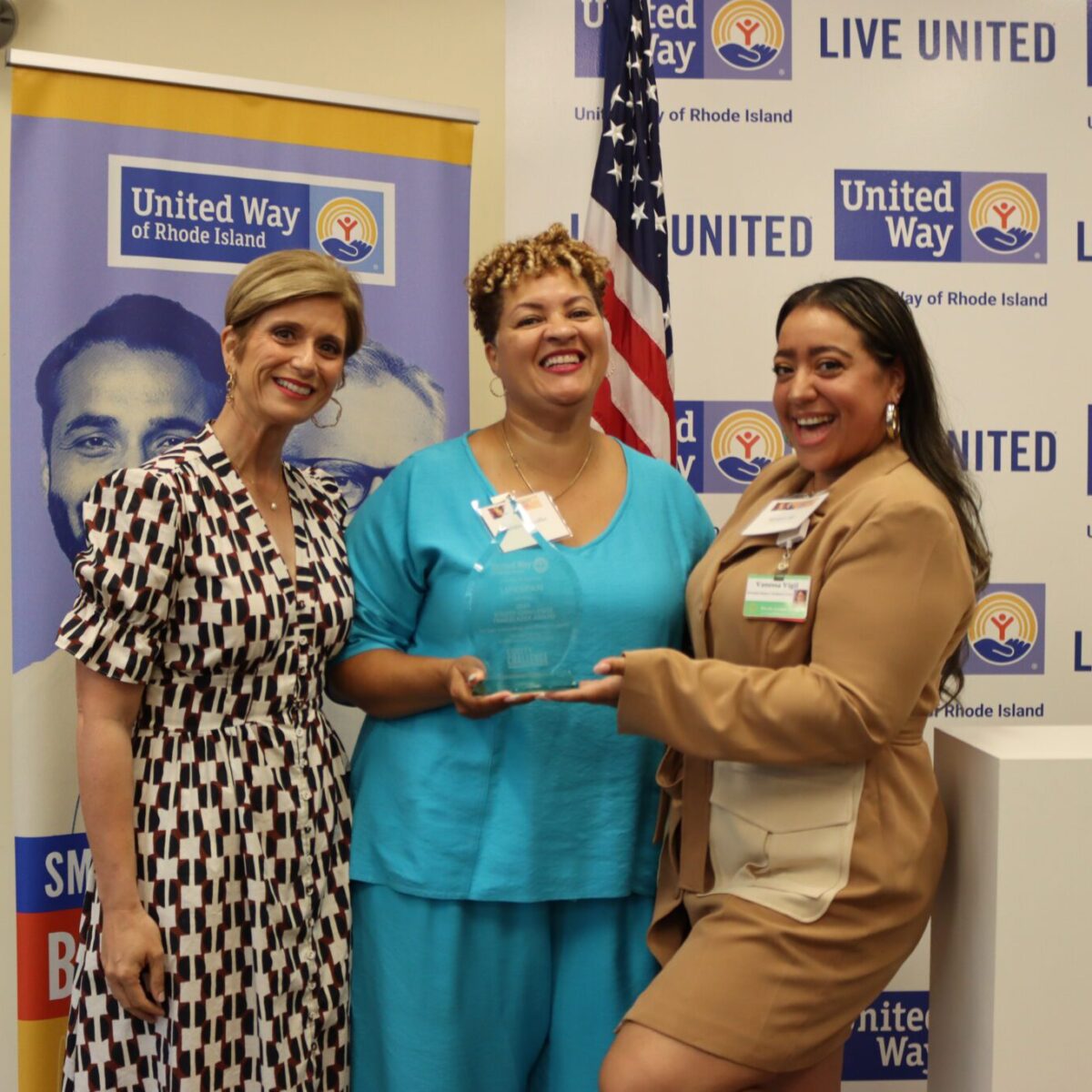 United Way of Rhode Island President and CEO Cortney Nicolato posing with Lifespan's Christin Zollicoffer and Vanessa Vigil.