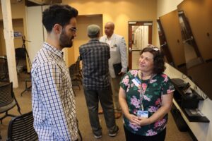 The Economic Progress Institute’s Hector Perez Aponte talking with United Way of Rhode Island’s Cristina Amedeo.