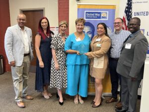 Members of Team United posing with Lifespan's Christin Zollicoffer and Vanessa Vigil.