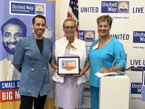 United Way of Rhode Island's Kevin Matta and Lifespan's Christin Zollicoffer posing with AccessPoint RI's Tracey Martins.