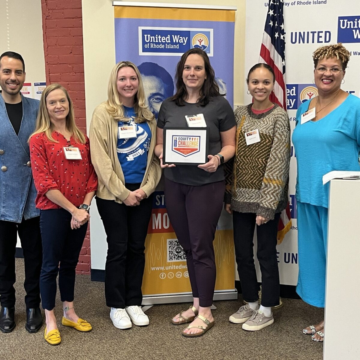 United Way of Rhode Island's Kevin Matta and Lifespan's Christin Zollicoffer with four Girls on the Run Rhode Island staff.